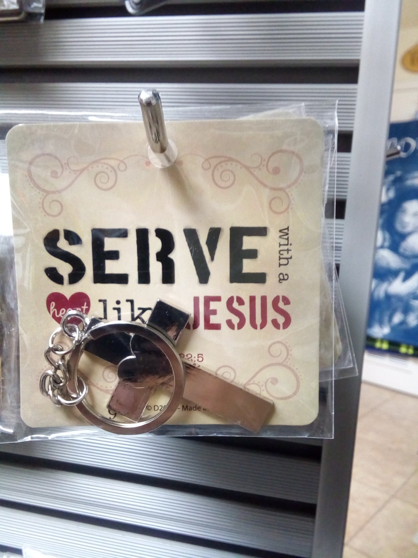 SERVE WITH A HEART LIKE JESUS. Llavero Keychain — available at The Gospel Bookstore