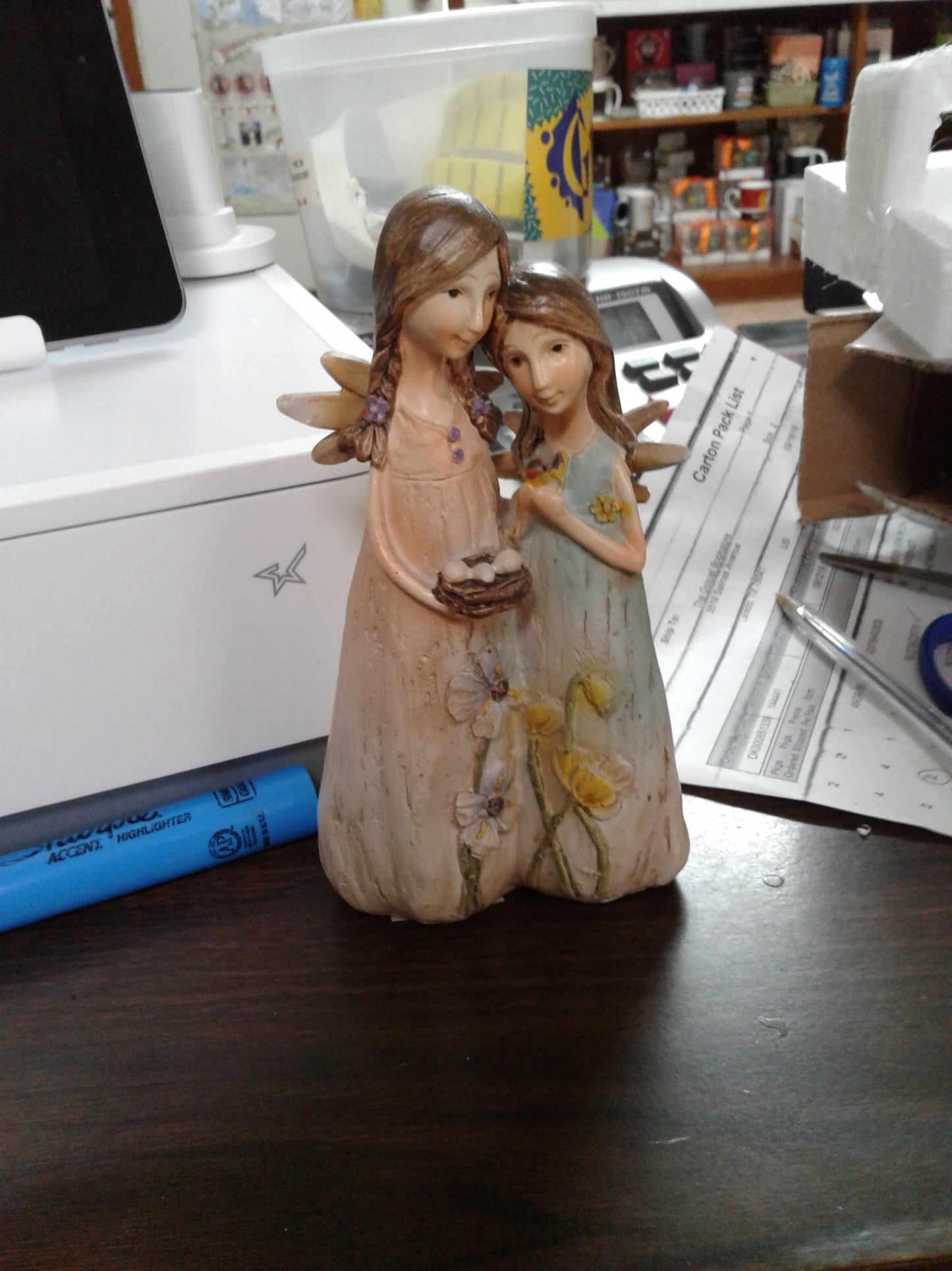 Resin angels with bird nest — available at The Gospel Bookstore