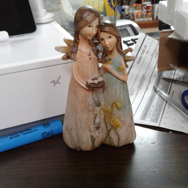 Resin angels with bird nest